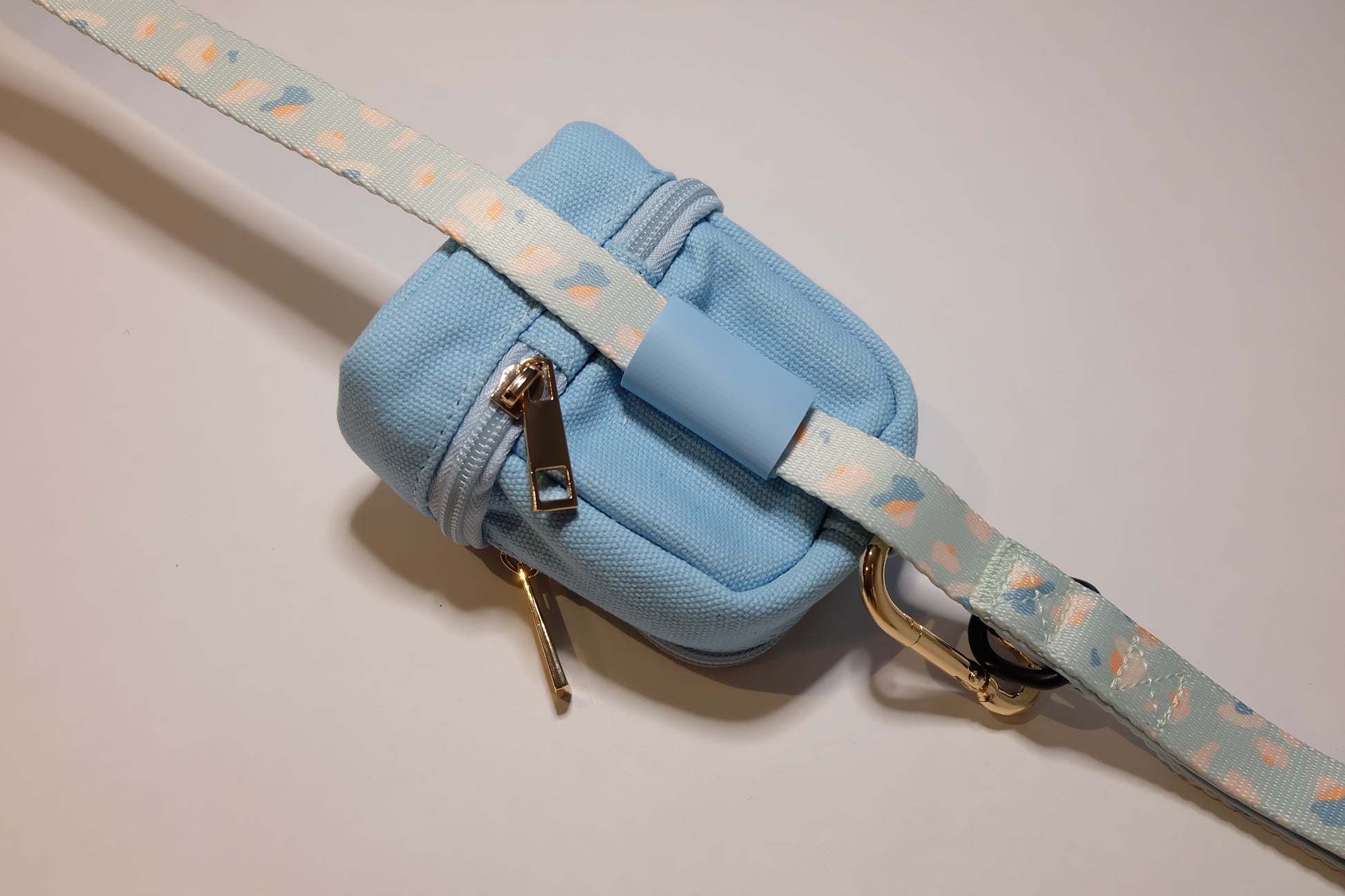 The Pet Central - The Paw Pack in Blue Attached to the Blue Cheetah Lead
