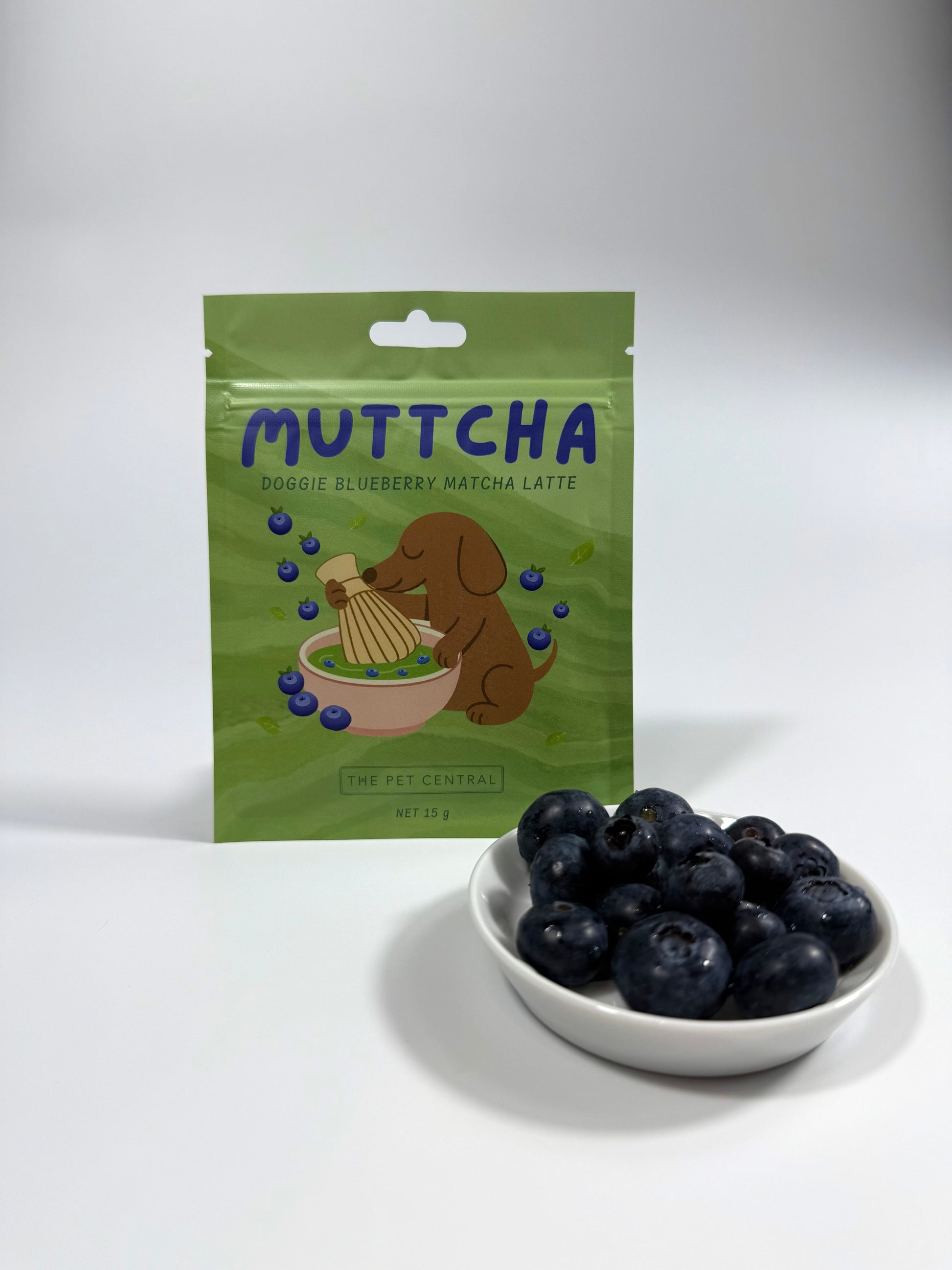 Blueberry Muttcha doggie blueberry matcha latte sachet beside fresh Australian blueberries