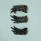 Three dehydrated crocodile feet laid flat on a white background – natural Australian dog chew treat