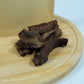 Close-up of dehydrated emu jerky strips – lean, chewy single-ingredient treat for dogs and cats