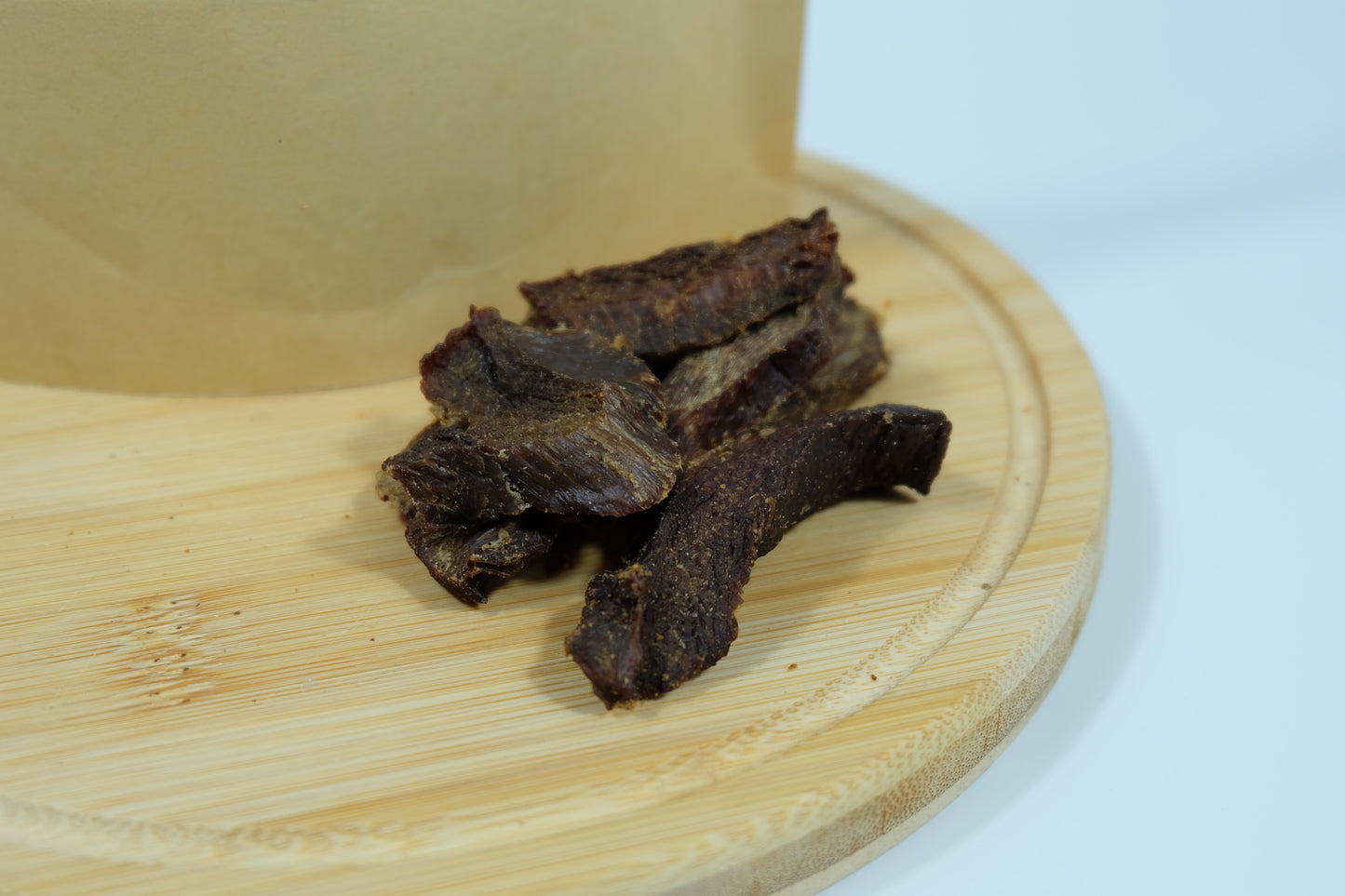 Close-up of dehydrated emu jerky strips – lean, chewy single-ingredient treat for dogs and cats