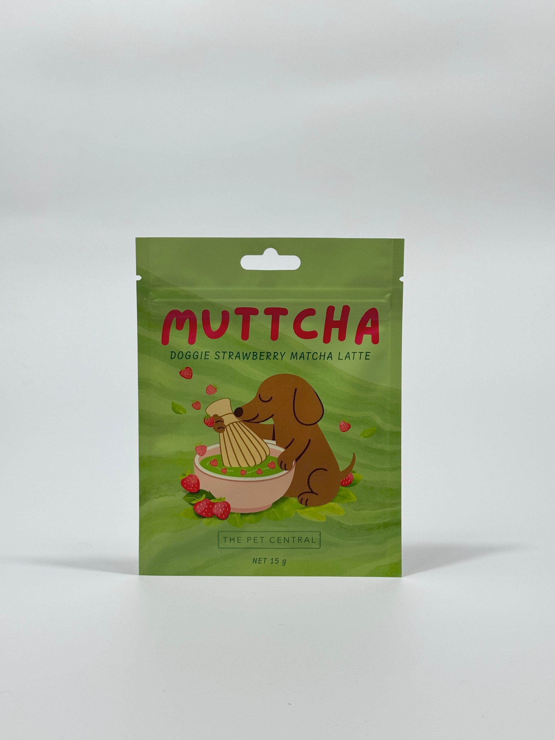 Green package of Muttcha Doggie Strawberry Matcha Latte on a white background