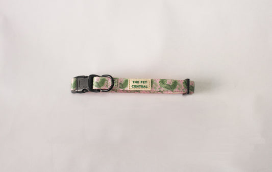The Pet Central Tropical Bloom dog collar with black plastic clip and black metal hardware.
